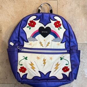 STATE Kane Backpack cow print straps lightning bolt rainbow design